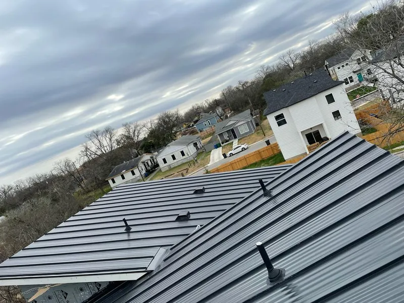 Standing seam metal roof panels with vents for Skylight Repair in Brookings